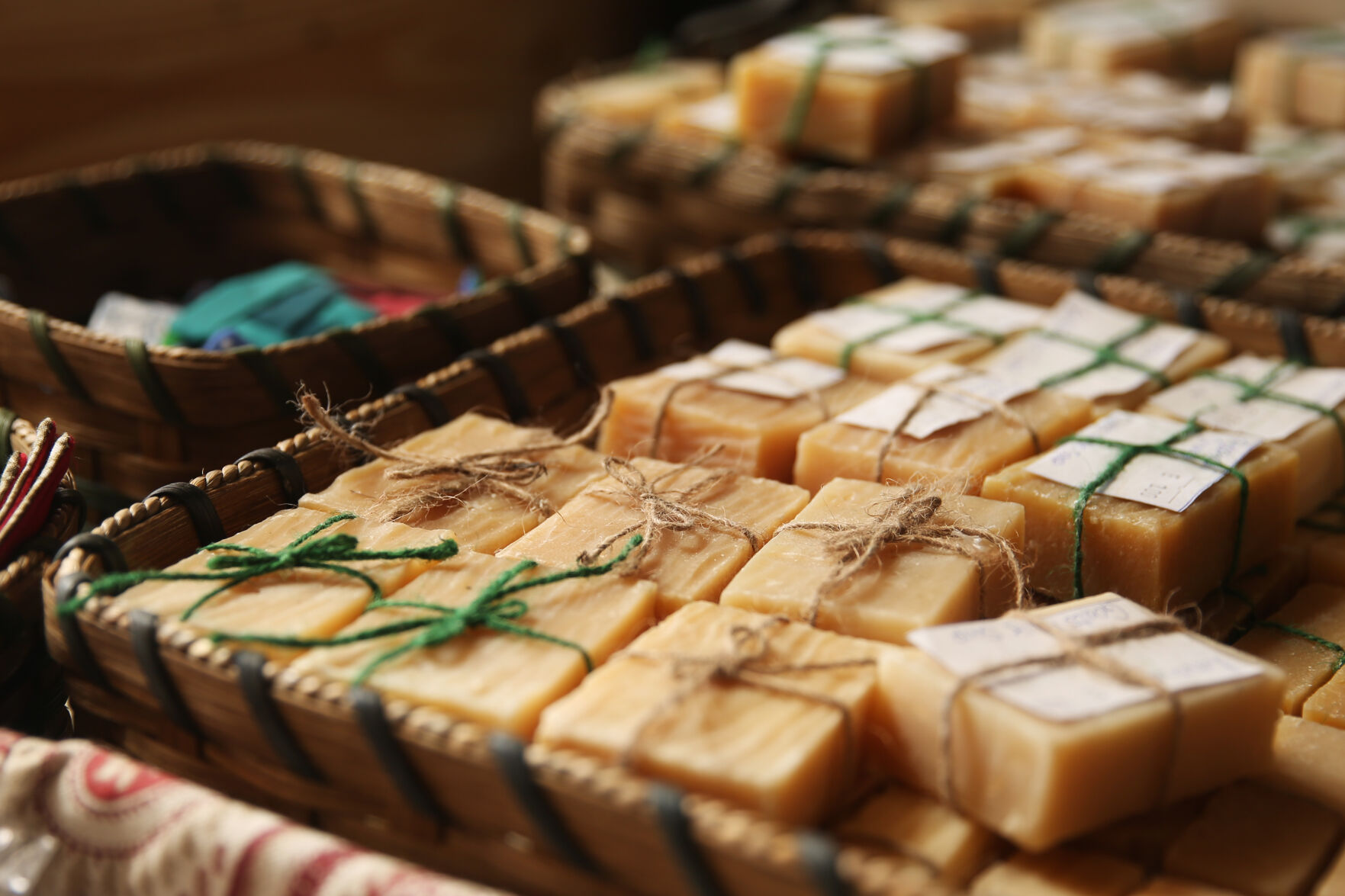 Homemade soaps fill baskets under a window in the new Amish store